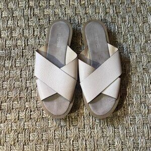 Maypol pebbled leather cross strap slides in blush beige